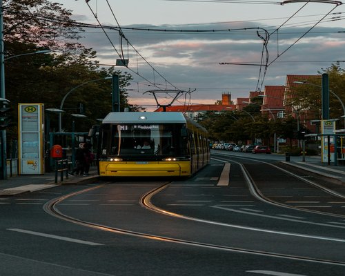 Person commuting thoughtfully on a tram in a city