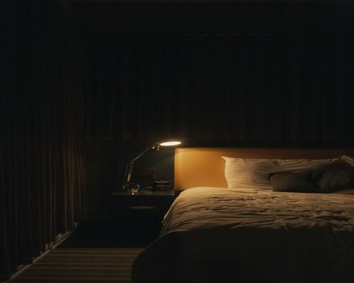 Cozy evening setting with soft lighting in a bedroom